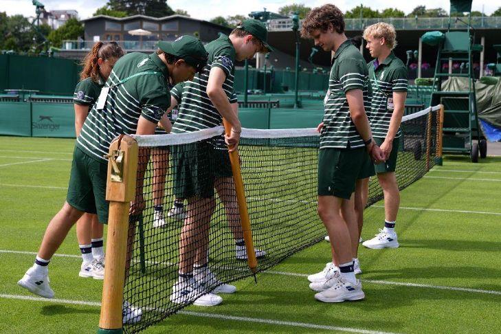 Wimbledon kept its courts lush green as other London lawns browned in record heat
