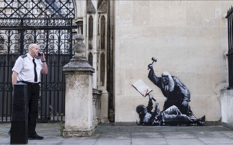 New Banksy mural of a judge beating a protester to be removed from